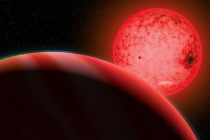 Concepción artística de un gran planeta gigante gaseoso en órbita alrededor de una pequeña estrella enana roja llamada TOI-5205
